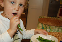 eating green beans in kitchen
