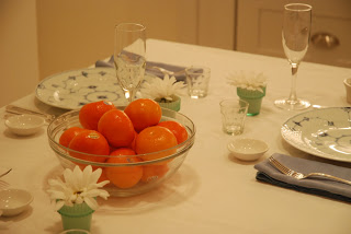 table setting with clementines and flowers